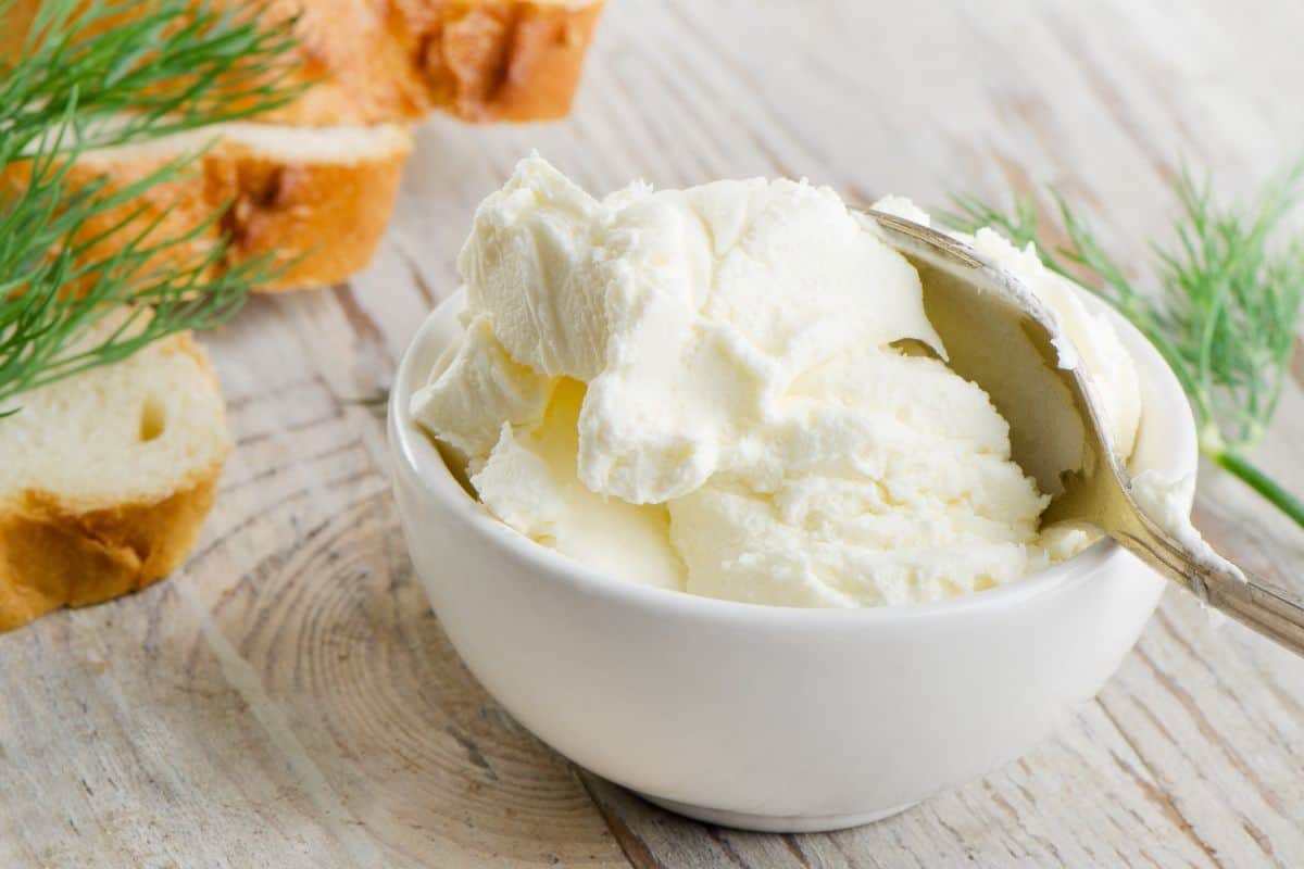 bowl of cream cheese with spoon in it