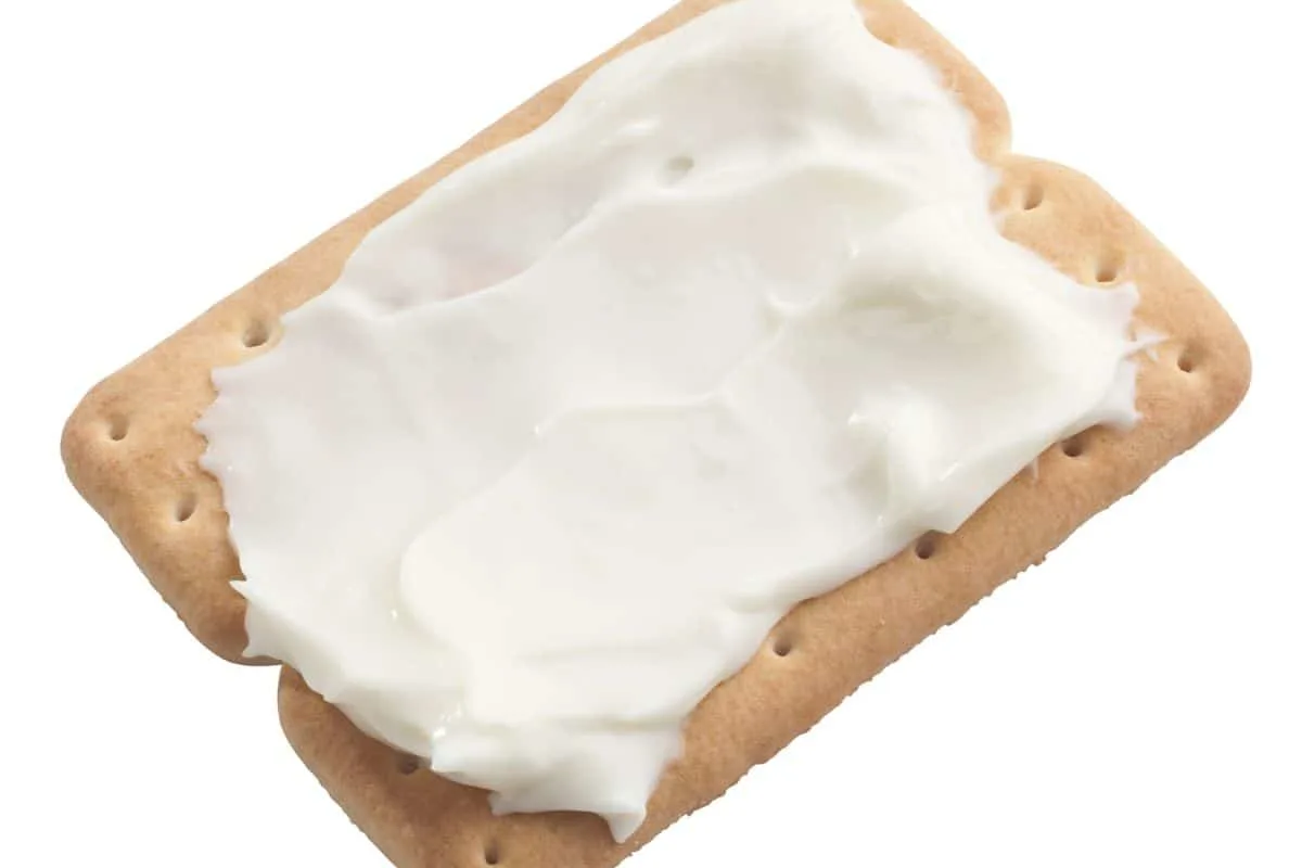 cracker with cream cheese smeared on it