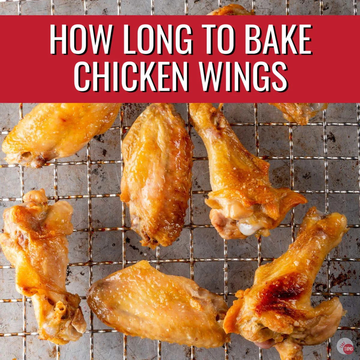 chicken wings on a rack with red banner and white text
