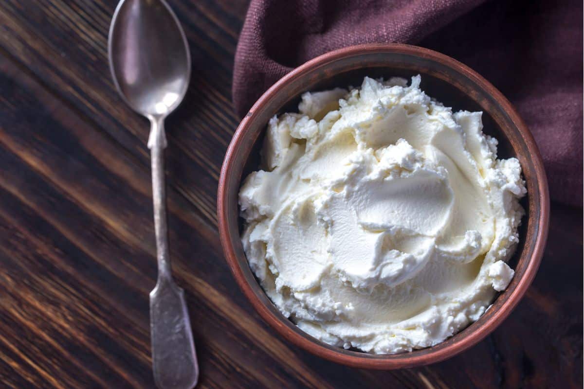 purple napkin and bowl of cottage cheese