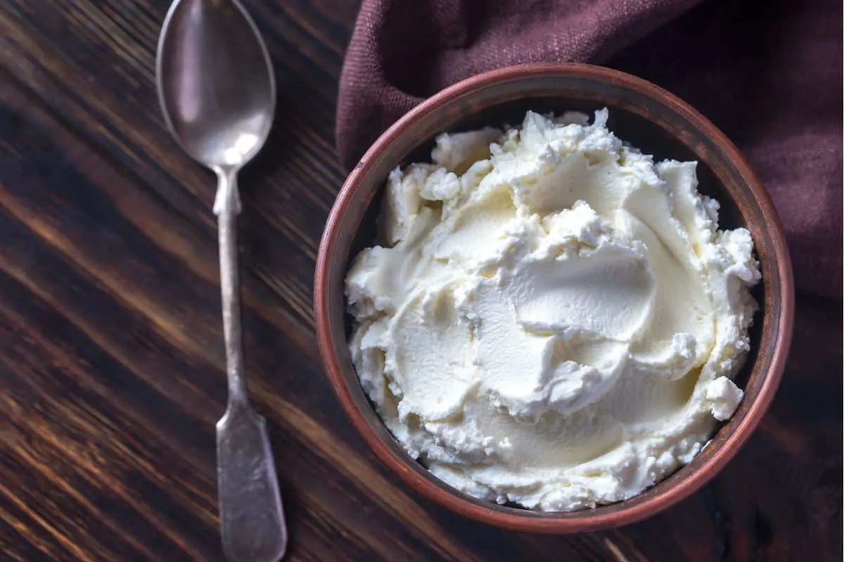 purple napkin and bowl of cottage cheese
