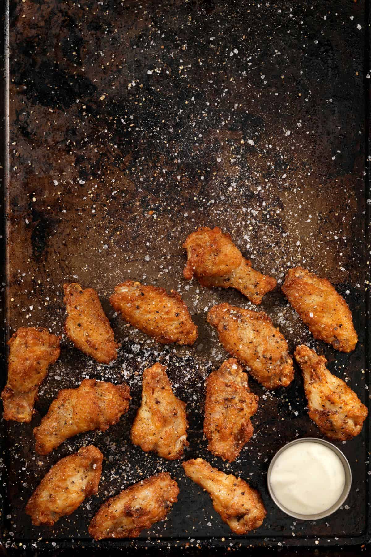 tray of wings sprinkled with salt