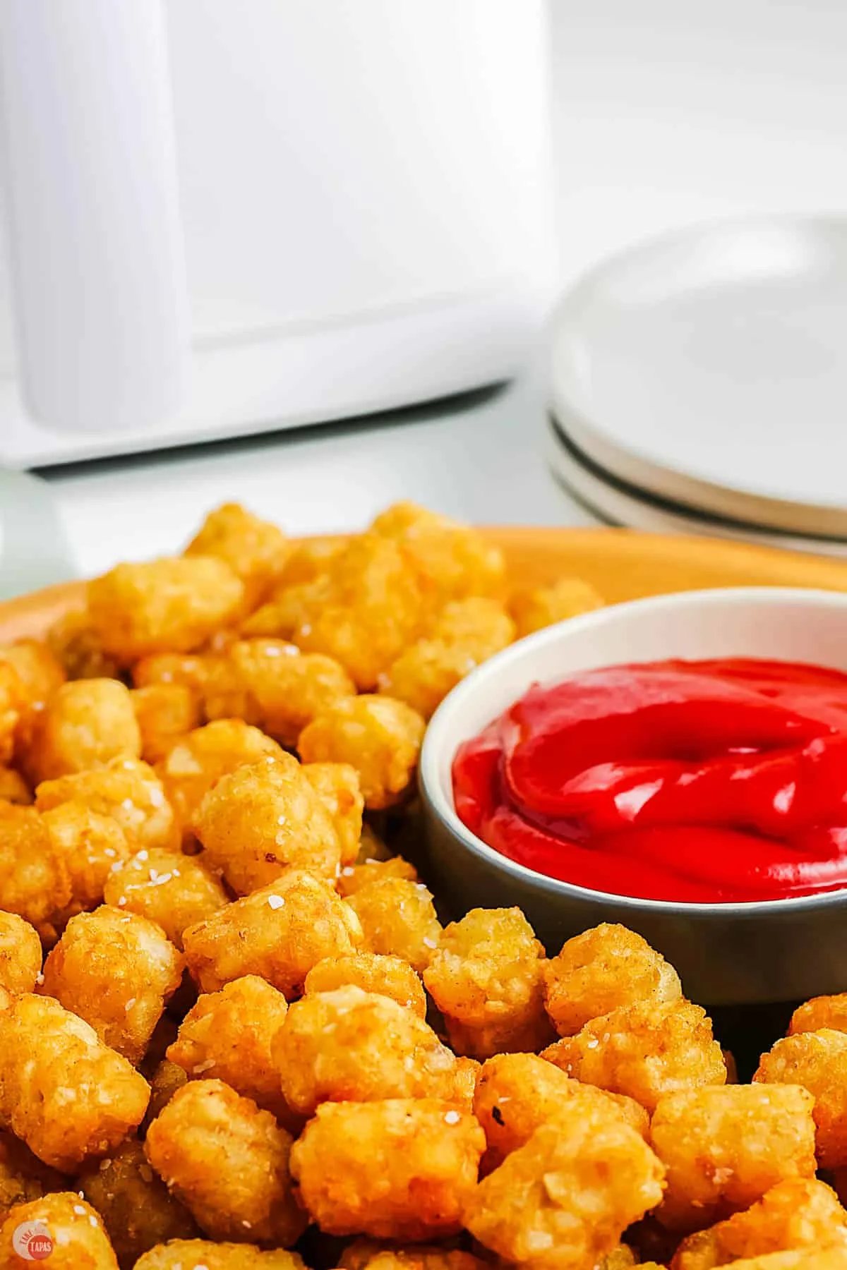 close up of tater tots on platter