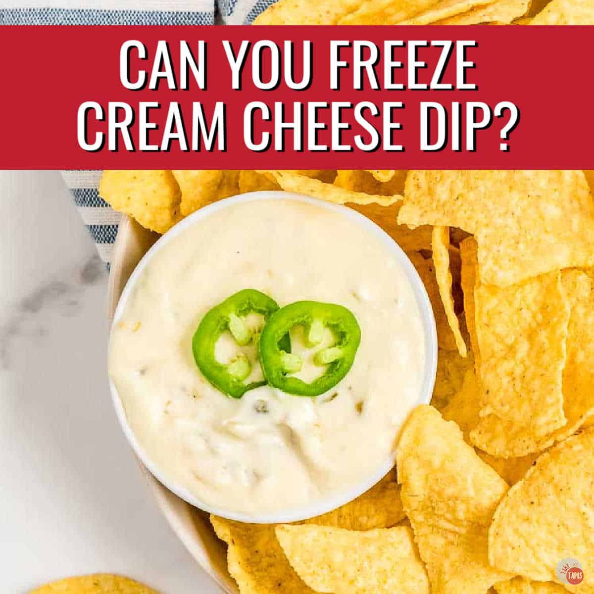 bowl of cream cheese dip with jalapeno on top with a red banner and white text