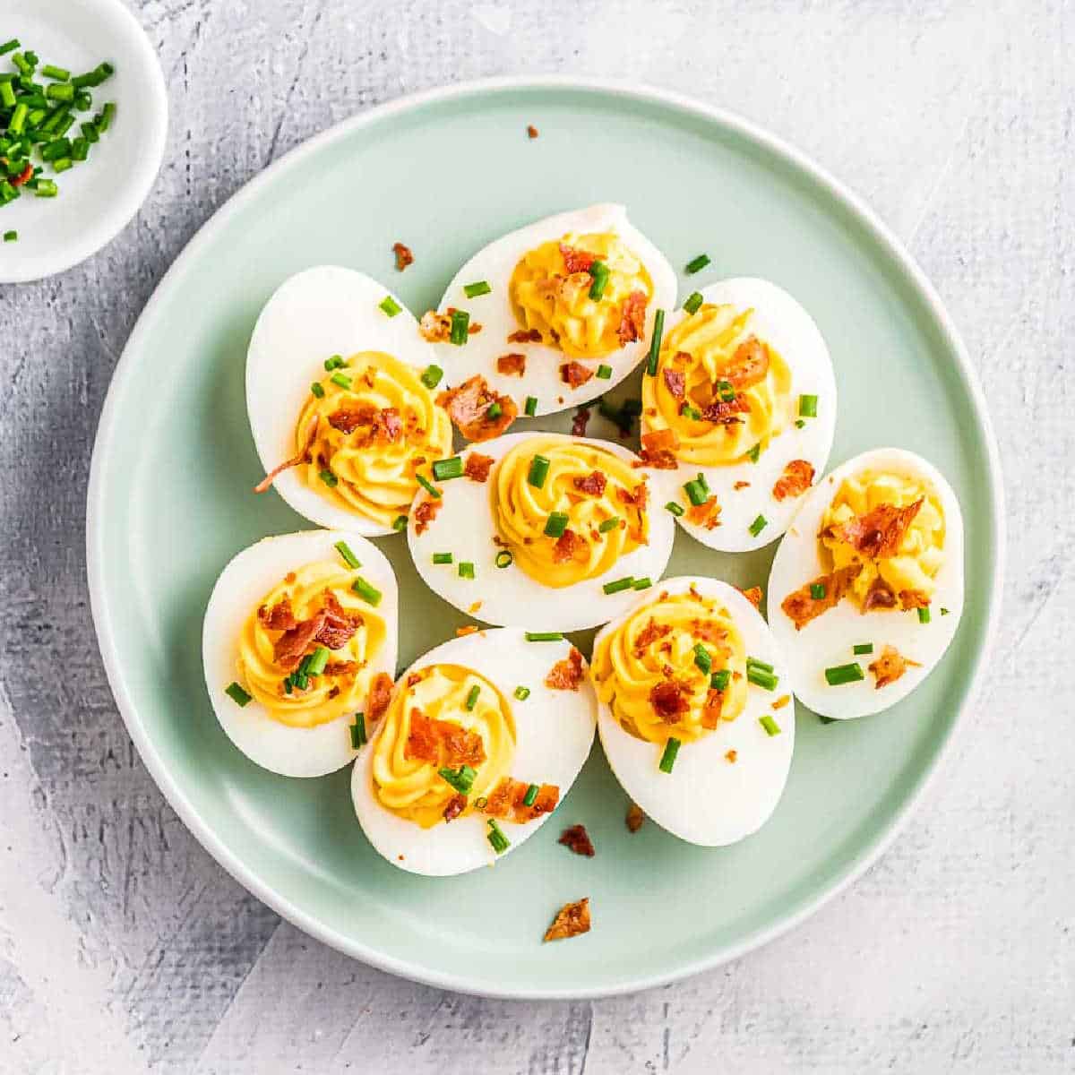 bacon deviled eggs on a plate
