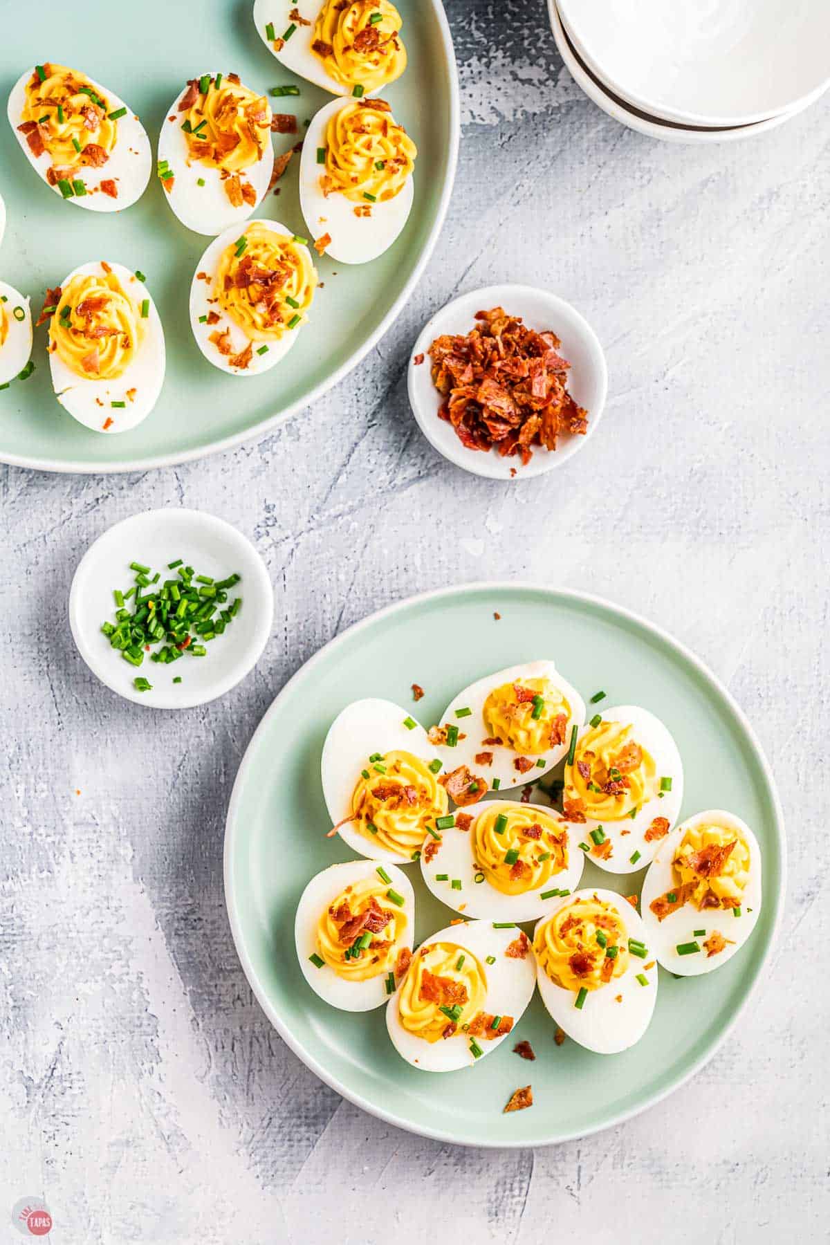 overhead picture of eggs on a plate with bacon