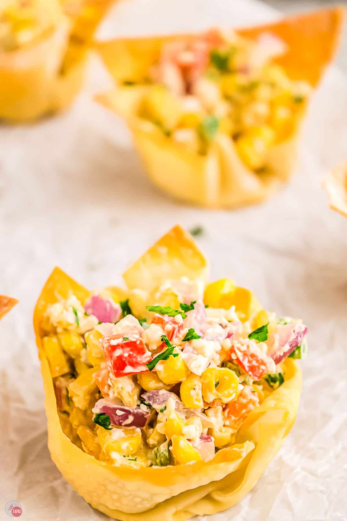 close up of street corn in a crispy cup