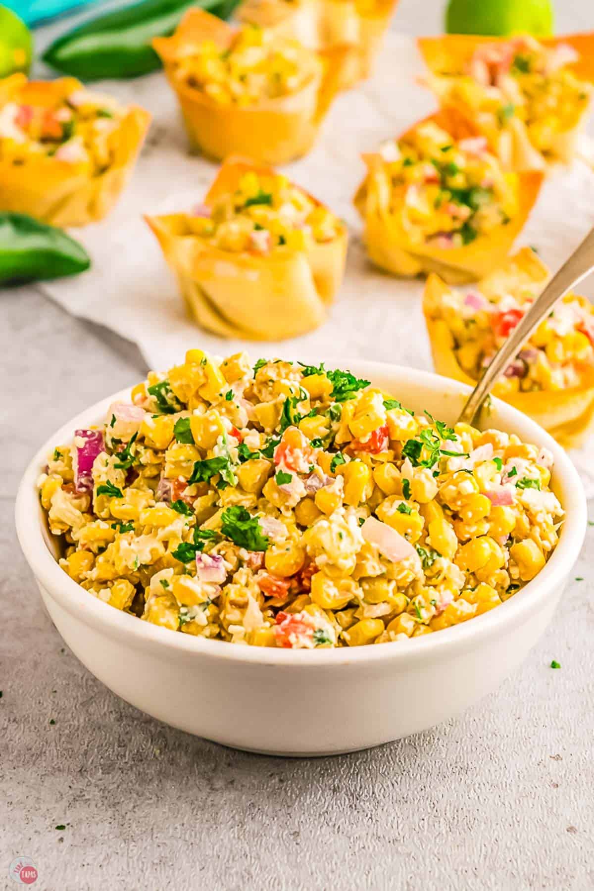 bowl of street corn salad with a spoon