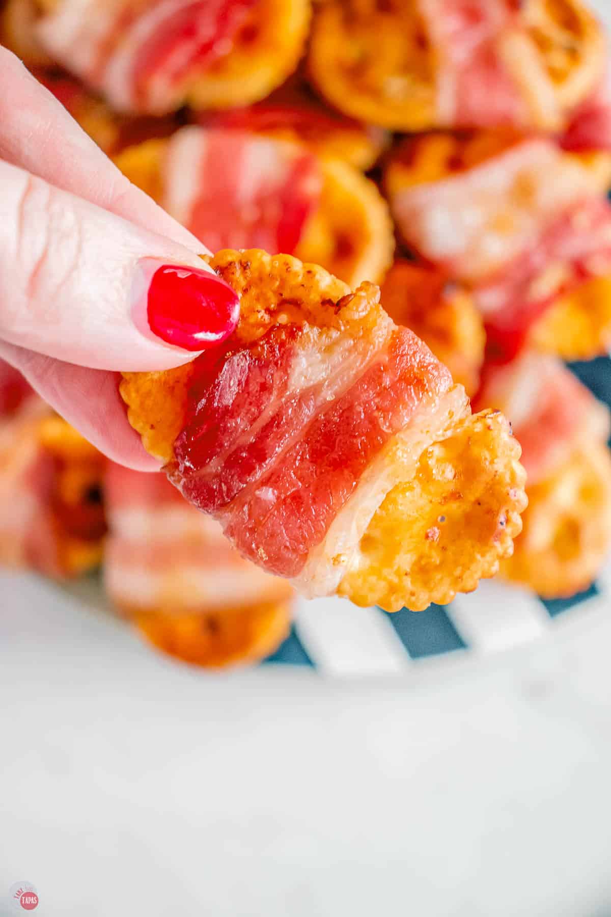 hand holding the perfect appetizer for your super bowl party