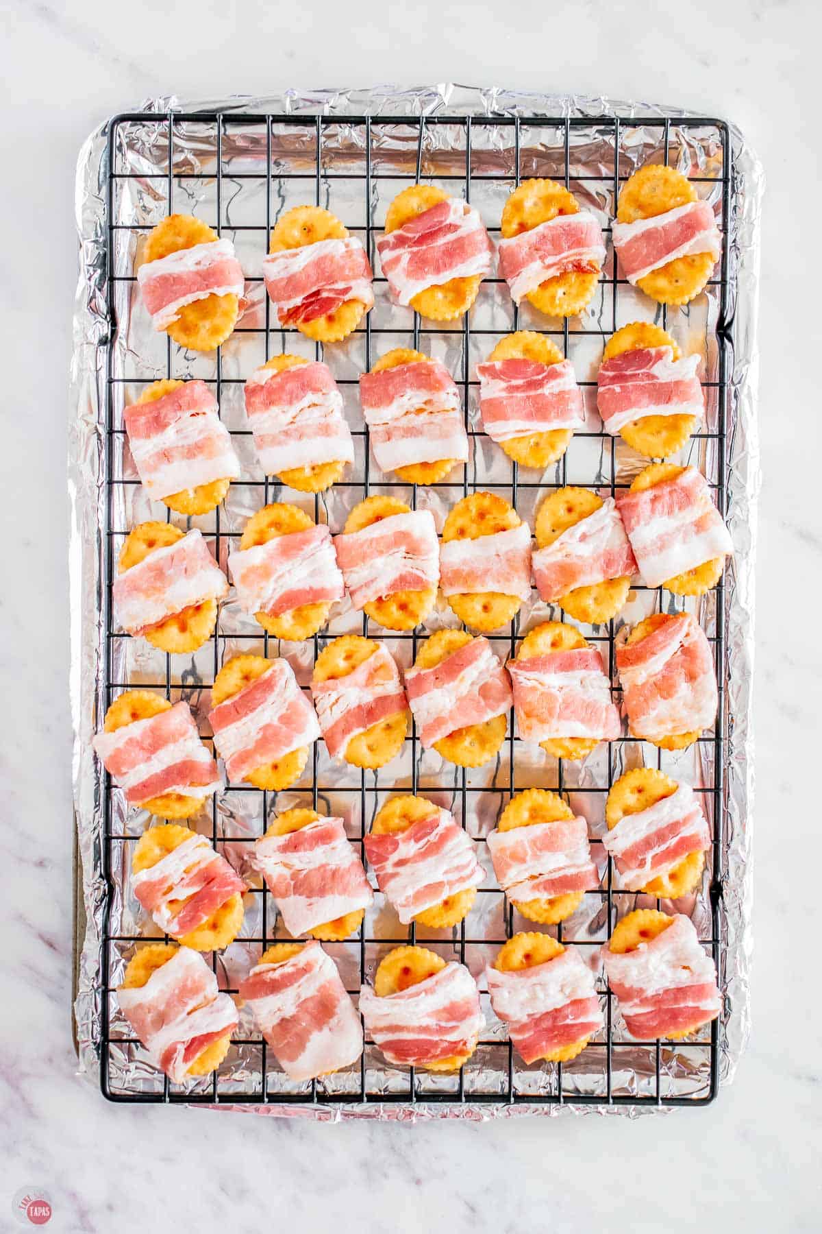 place bacon around the crackers