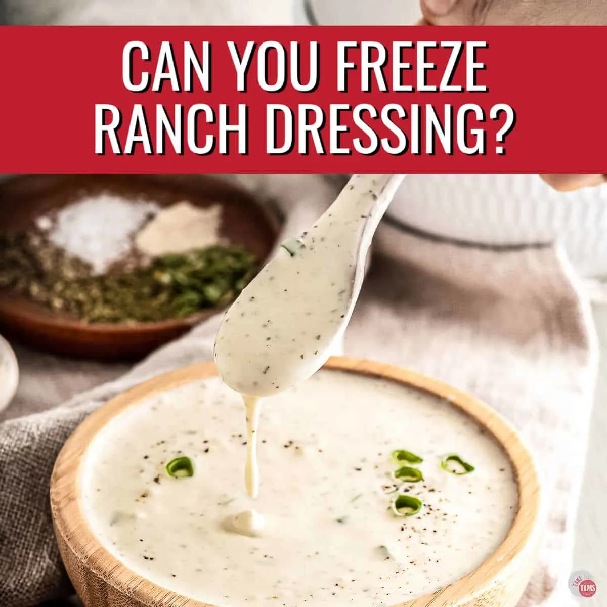 bowl of white dressing with red banner and white text