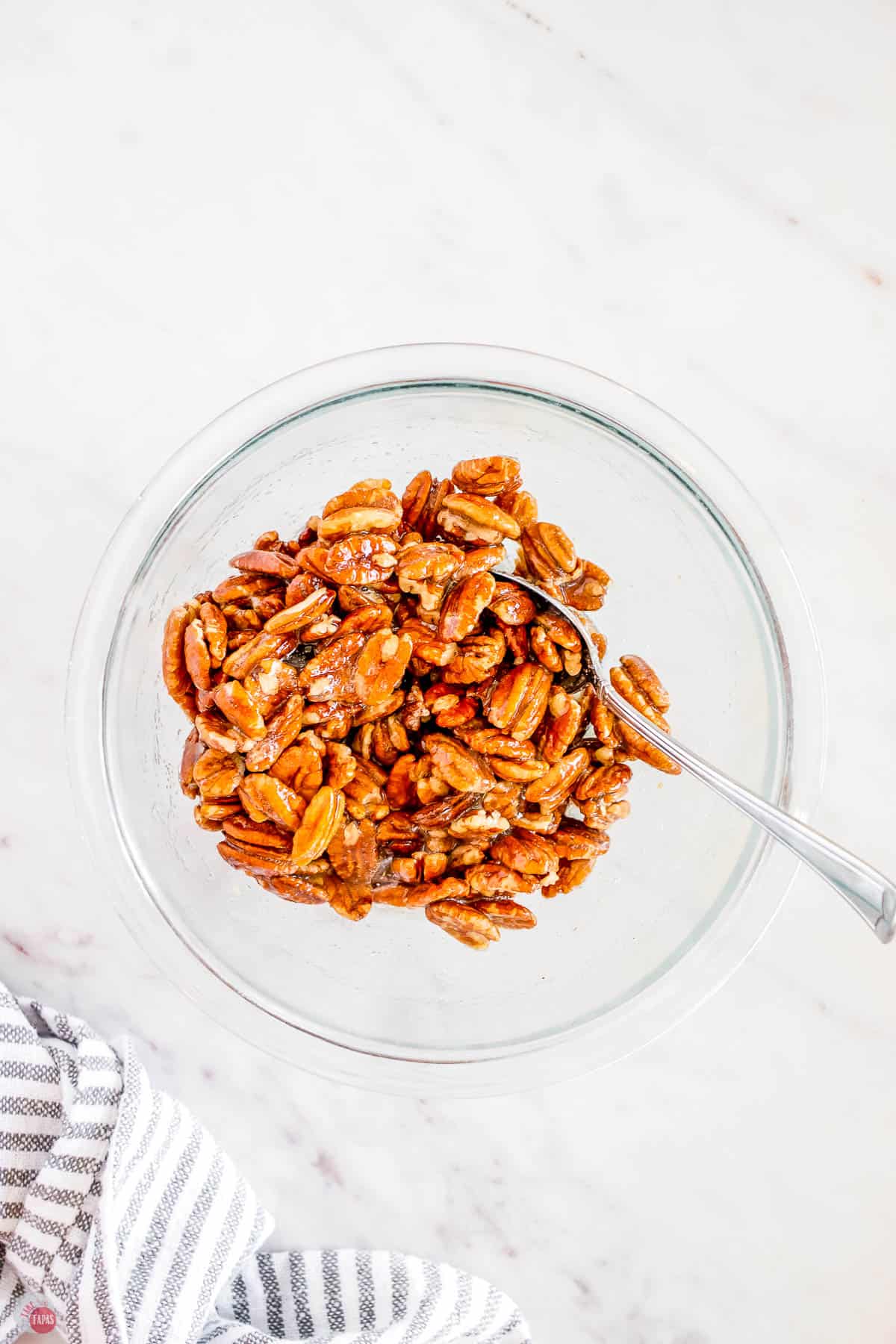 bowl of praline pecans before baking