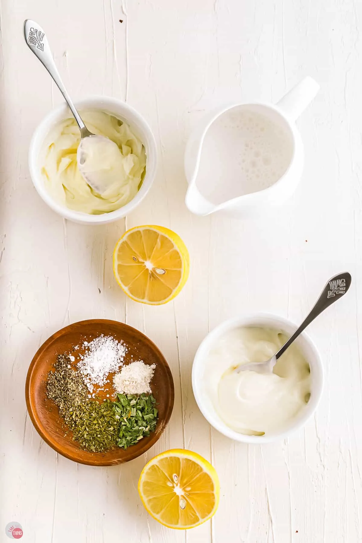 ingredients for ranch dressing on a wood backdrop