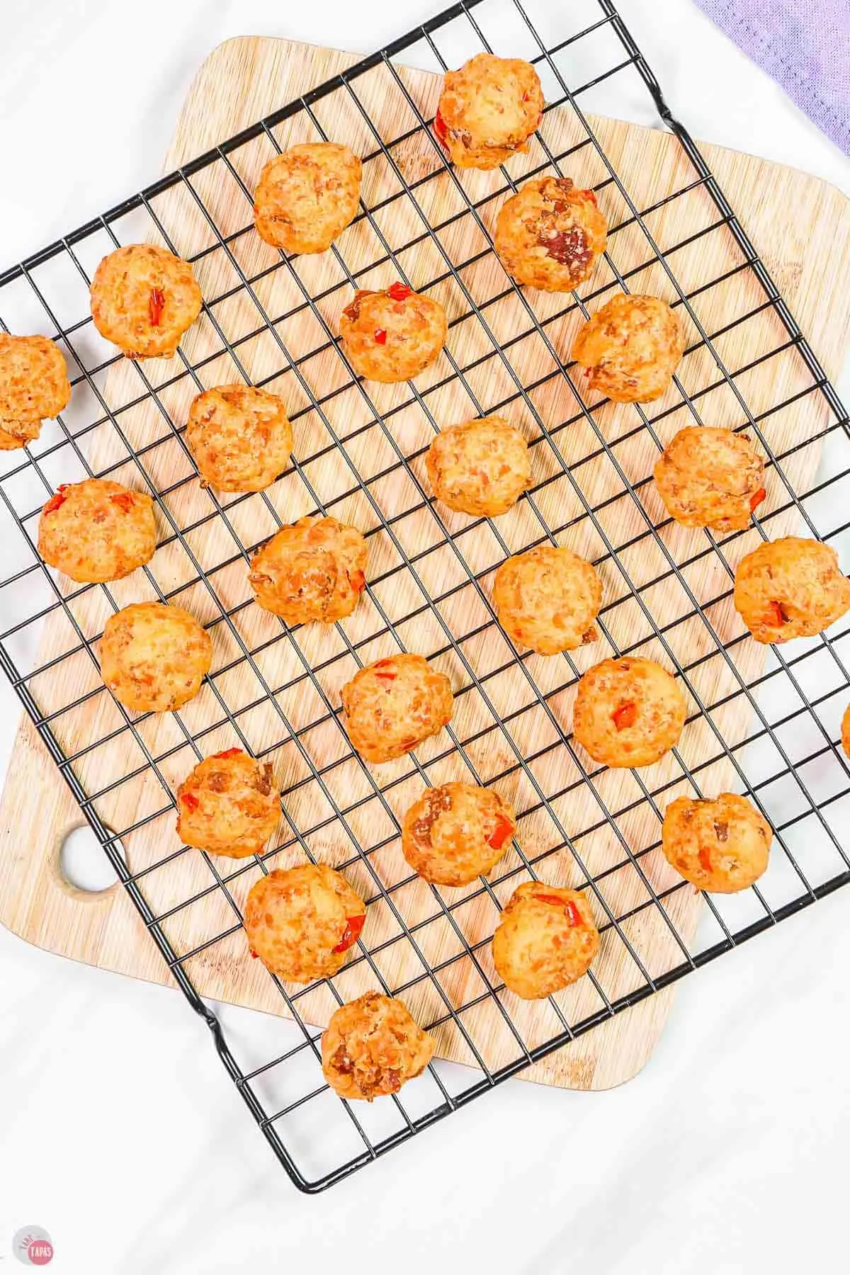 baked sausage balls on a wire rack