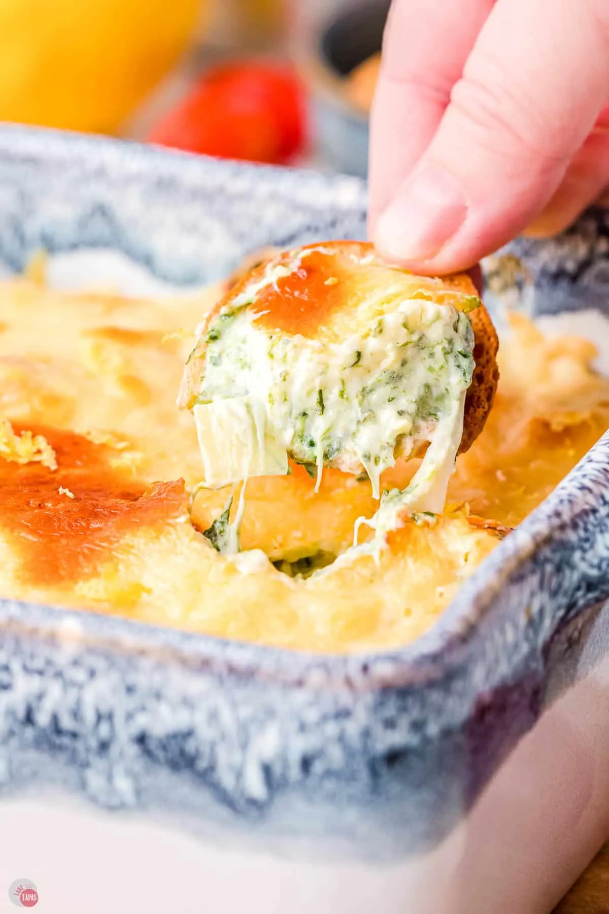 baked spinach artichoke dip in a prepared baking dish