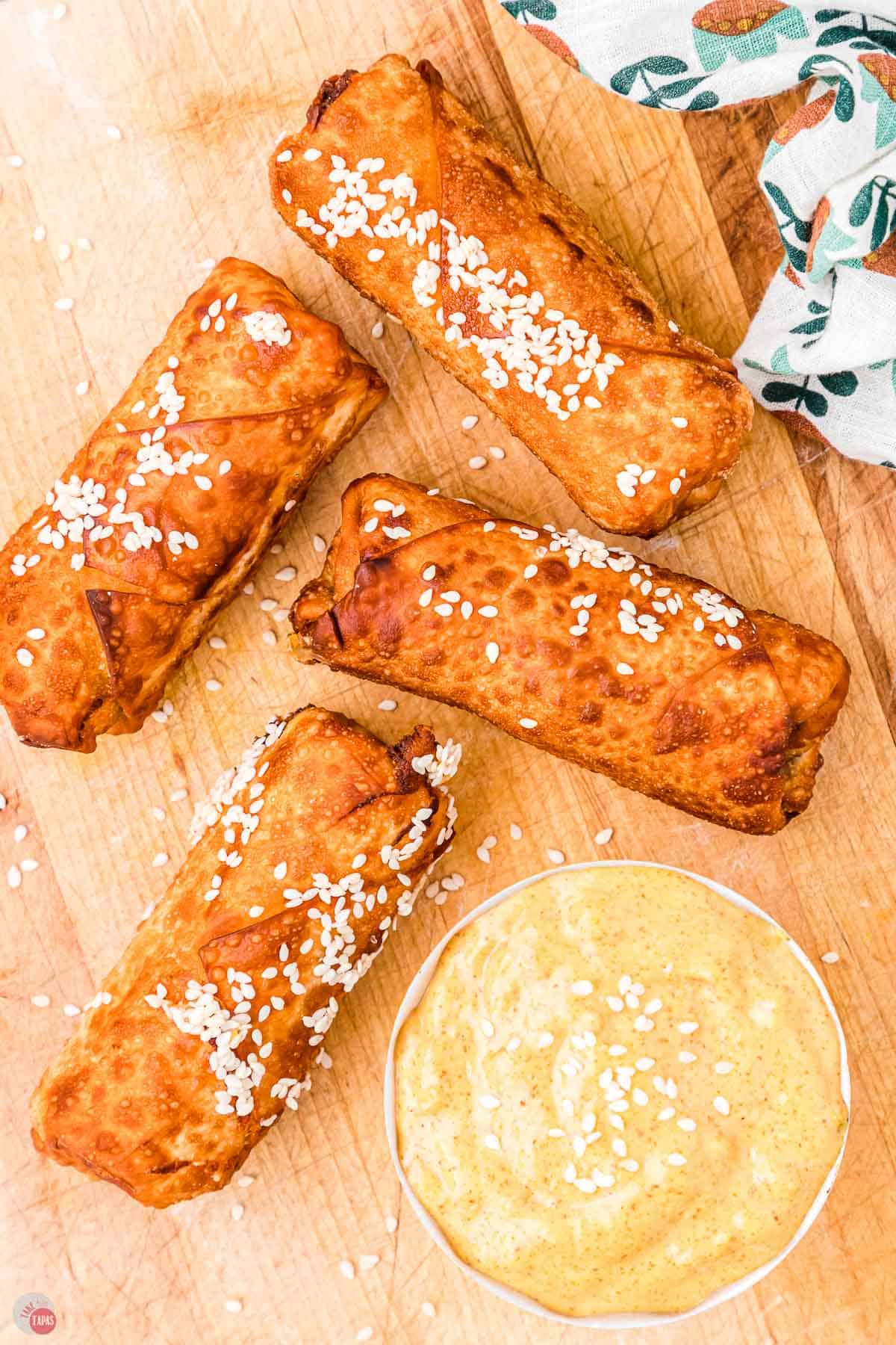 big mac egg rolls on a wood board