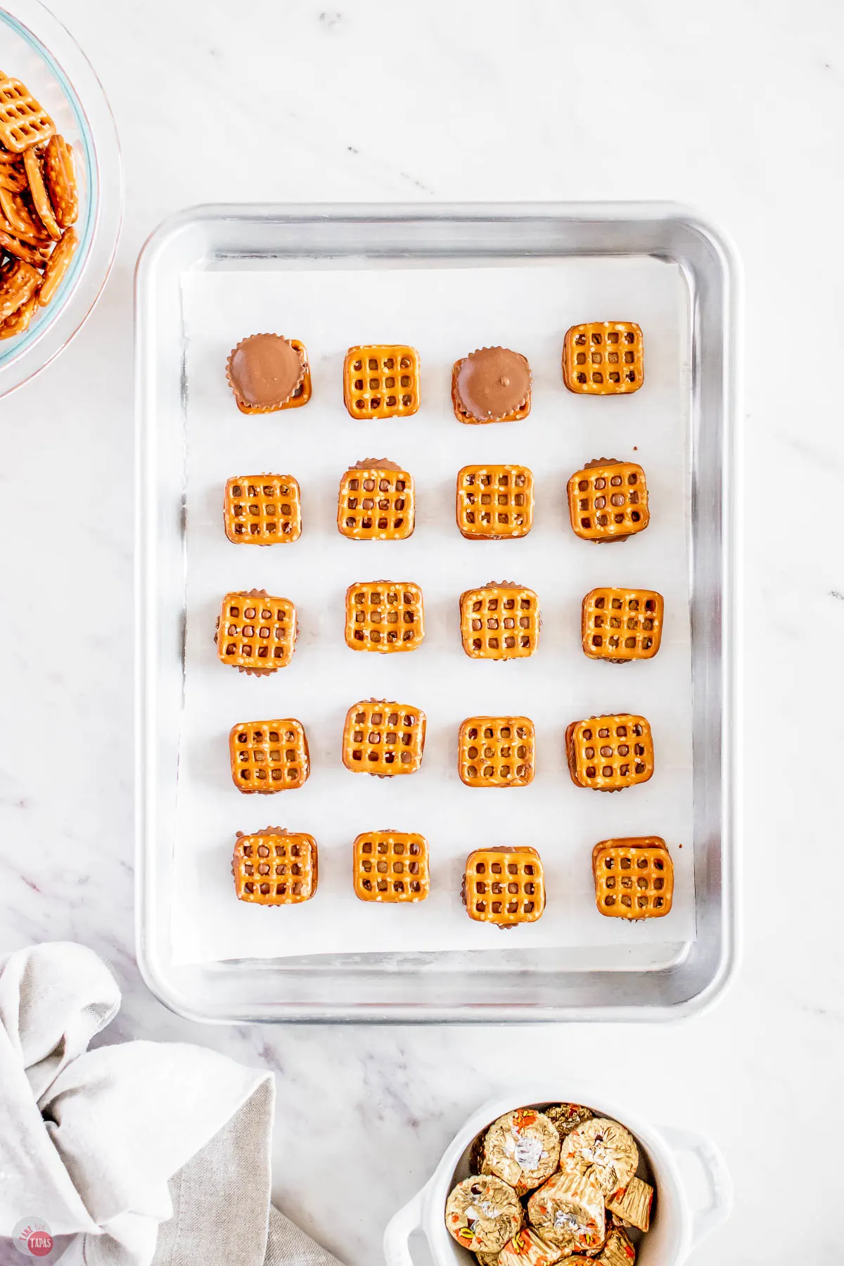 pretzel sandwiches on a baking sheet