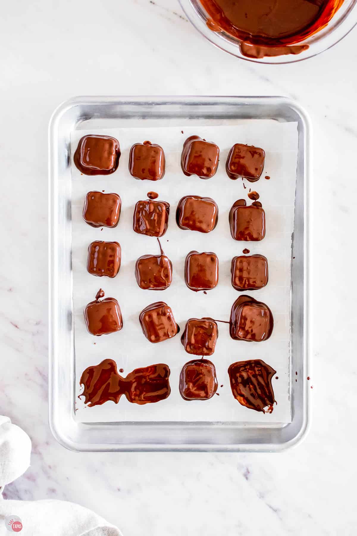 pretzels dipped in chocolate on ungreased cookie sheets