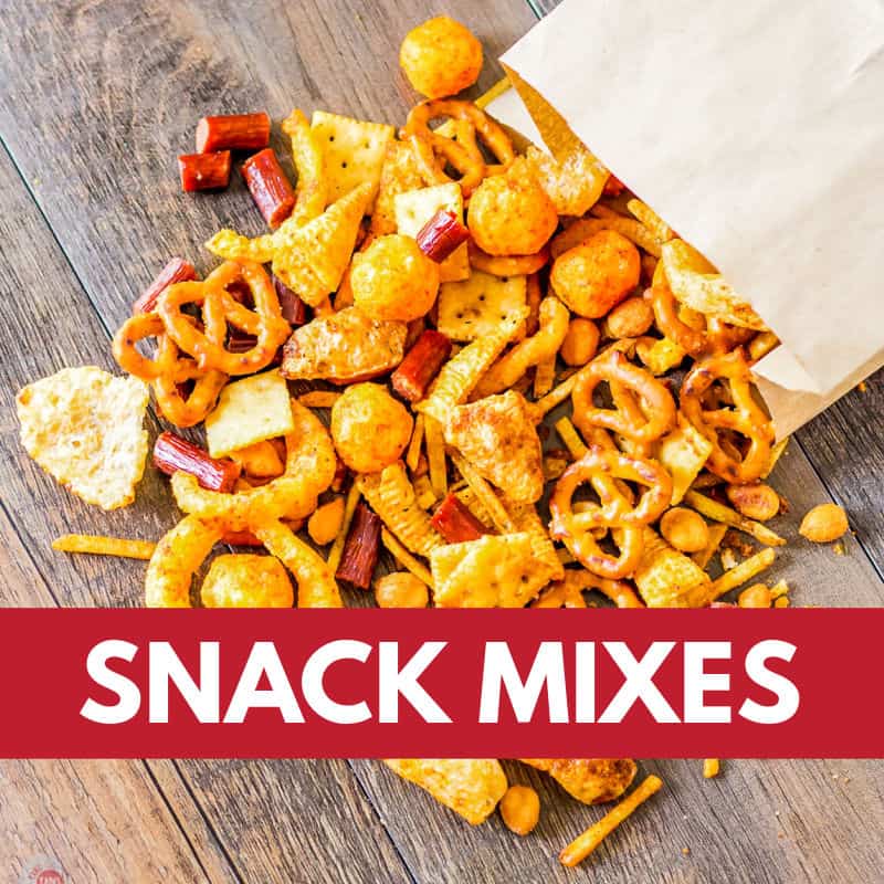 bag of snack mix pouring on a wood board with red banner with text "snack mixes"