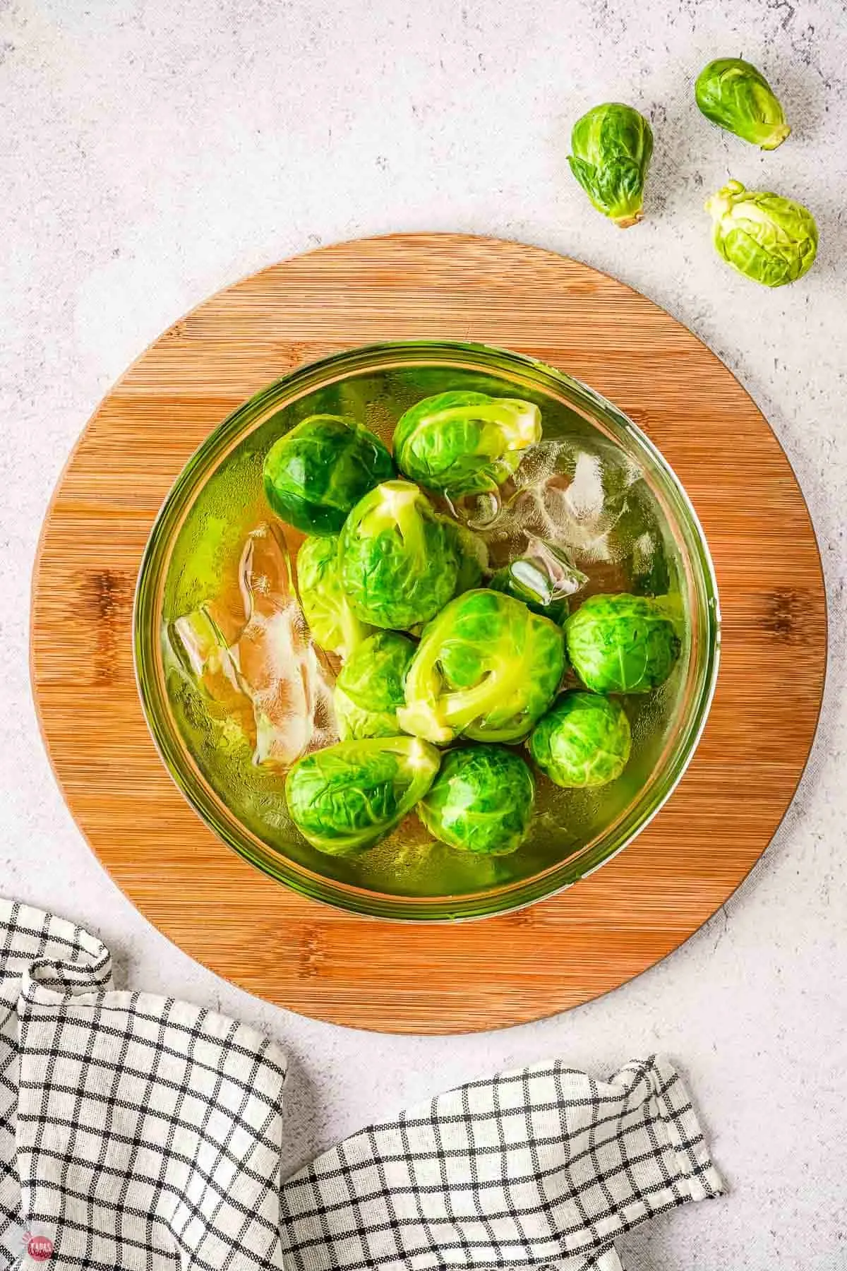 fresh brussels sprouts in an ice bath