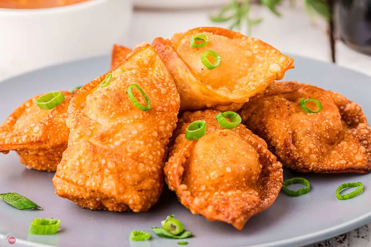 close up of shrimp rangoon with green onions