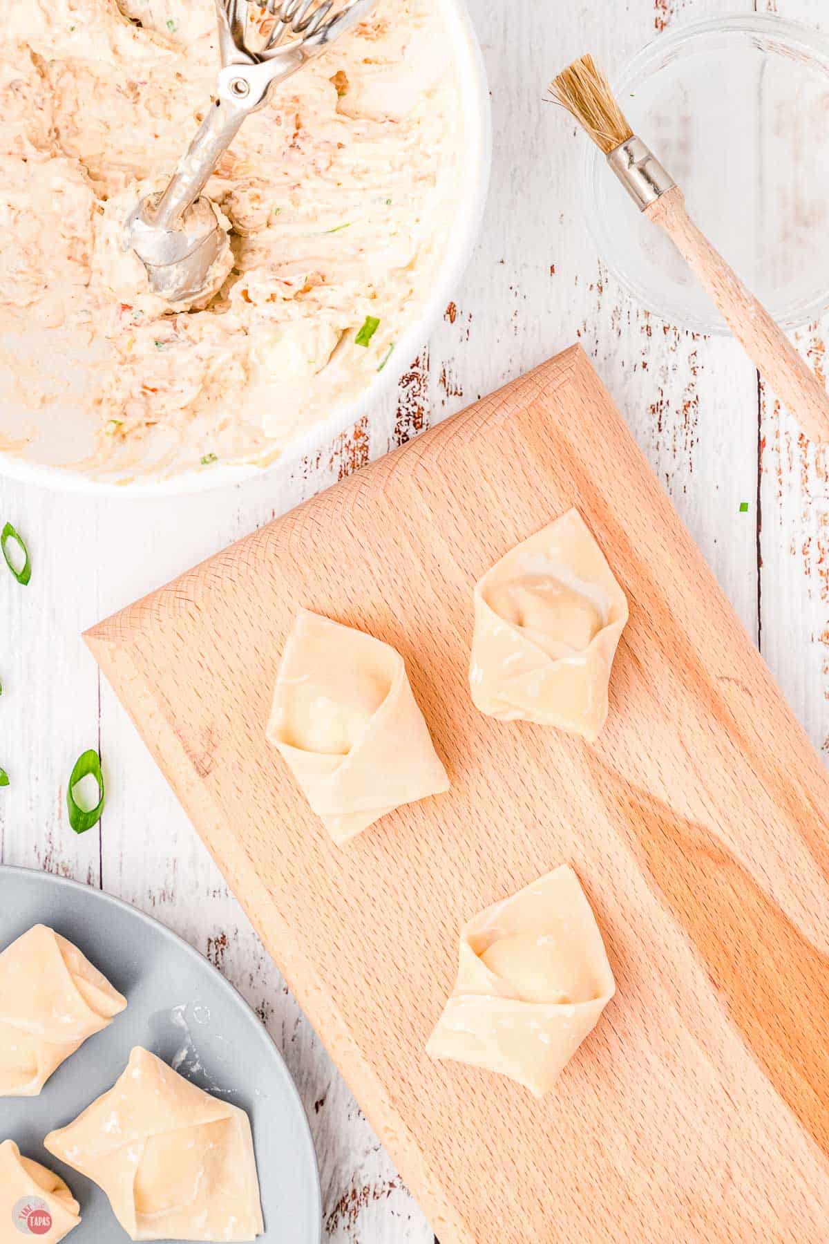 formed wontons on a cutting board