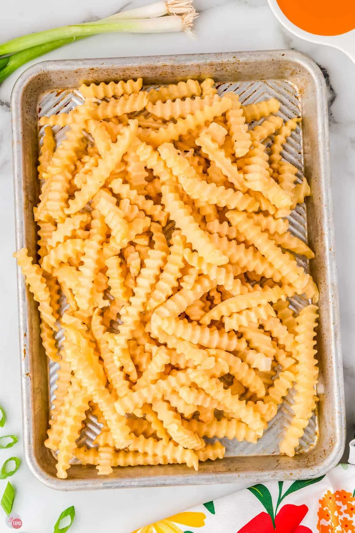 frozen fries on a baking sheet