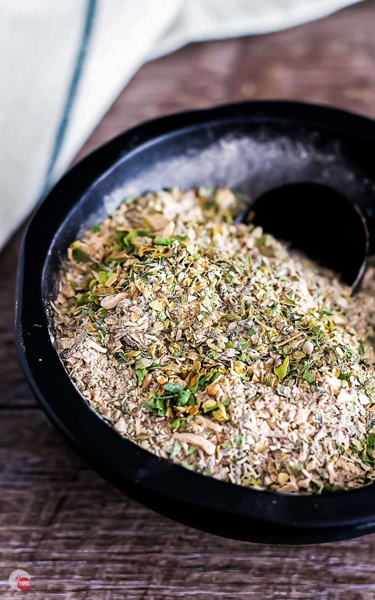 close up of spices in a black bowl