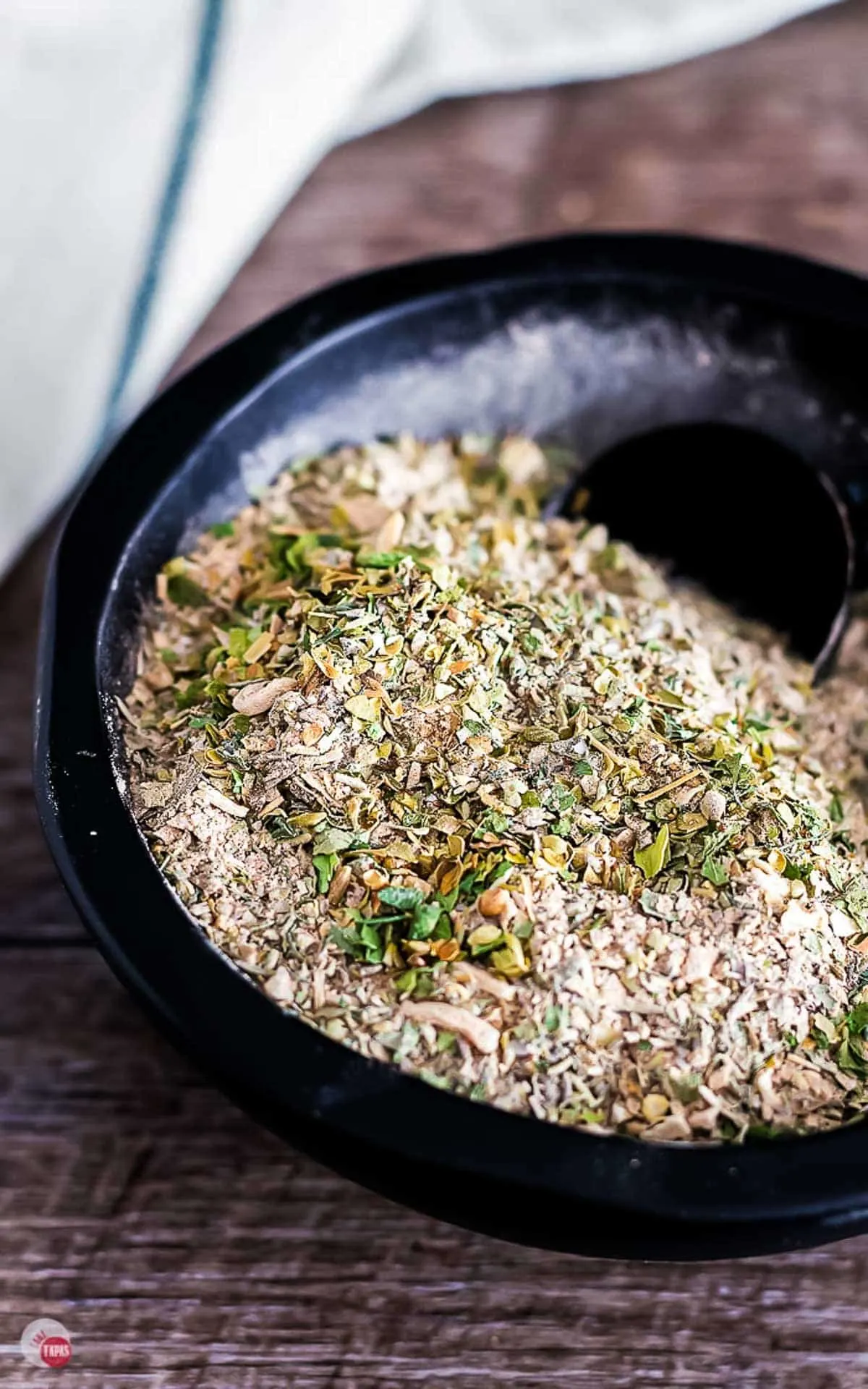 close up of spices in a black bowl
