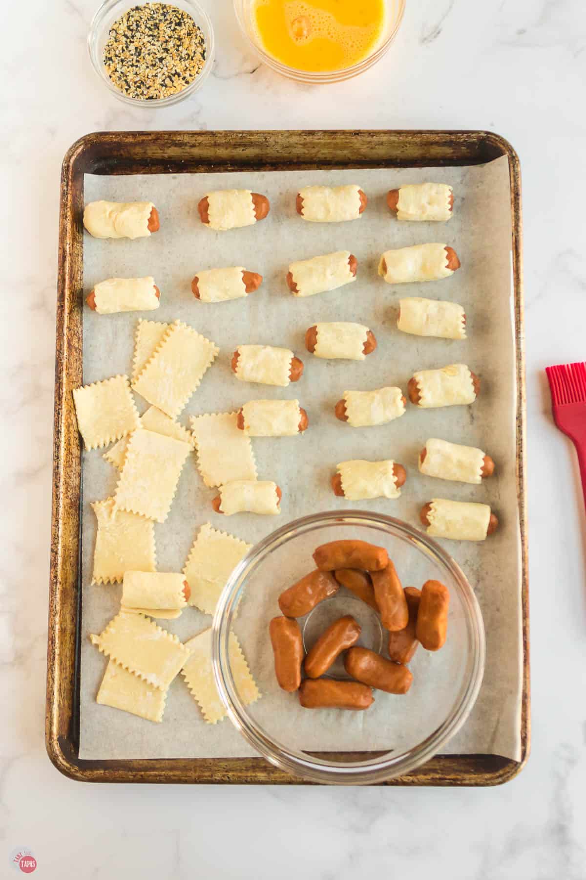 lil smokies on a baking sheet with pastry dough