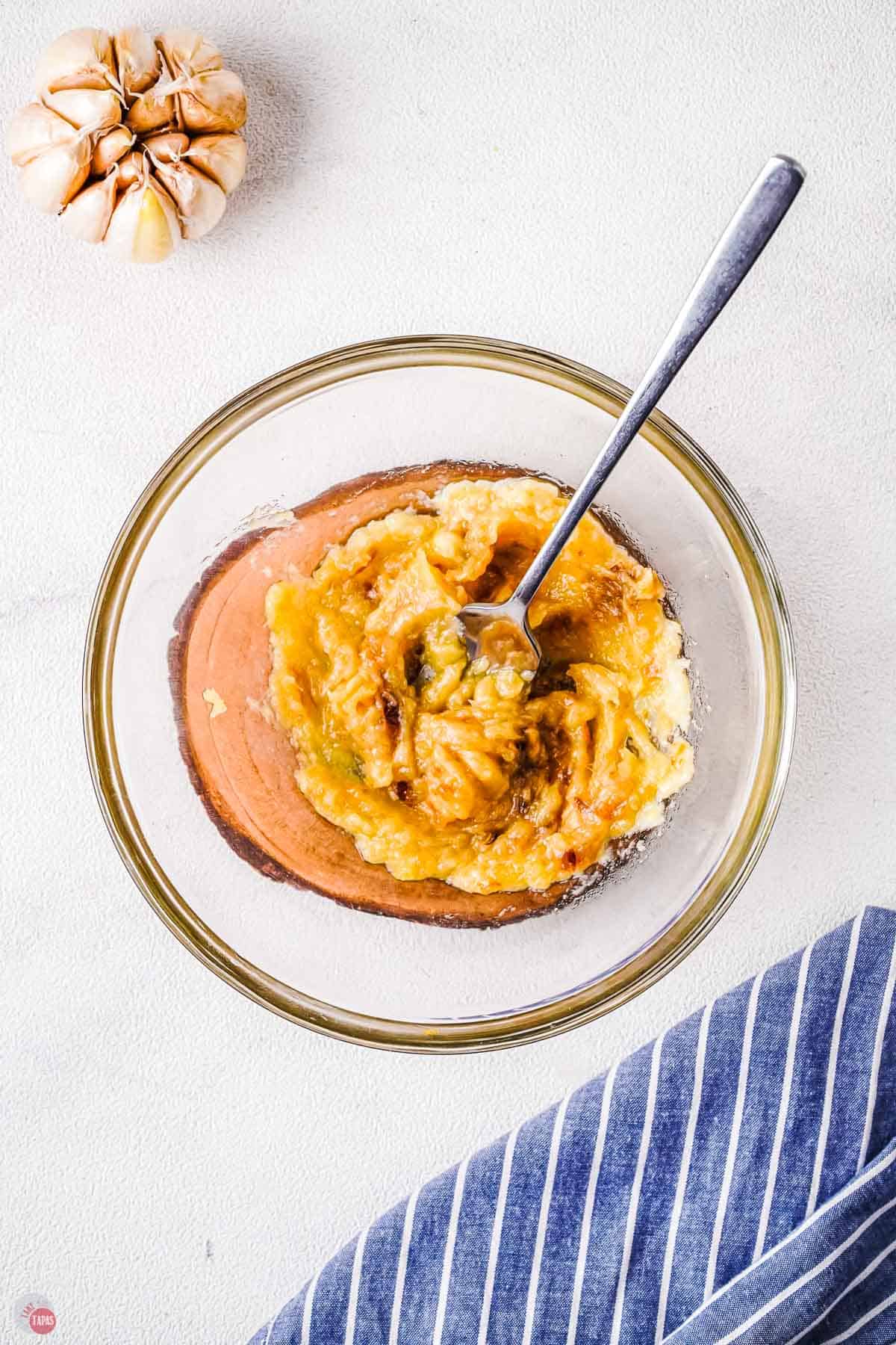 mashed roasted garlic cloves in a bowl