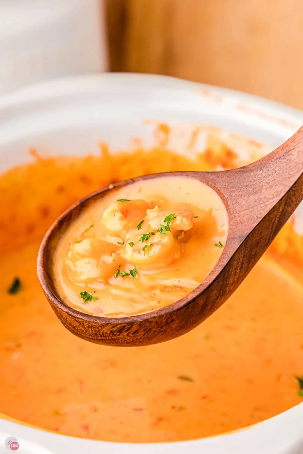 shrimp rotel dip in a wood spoon