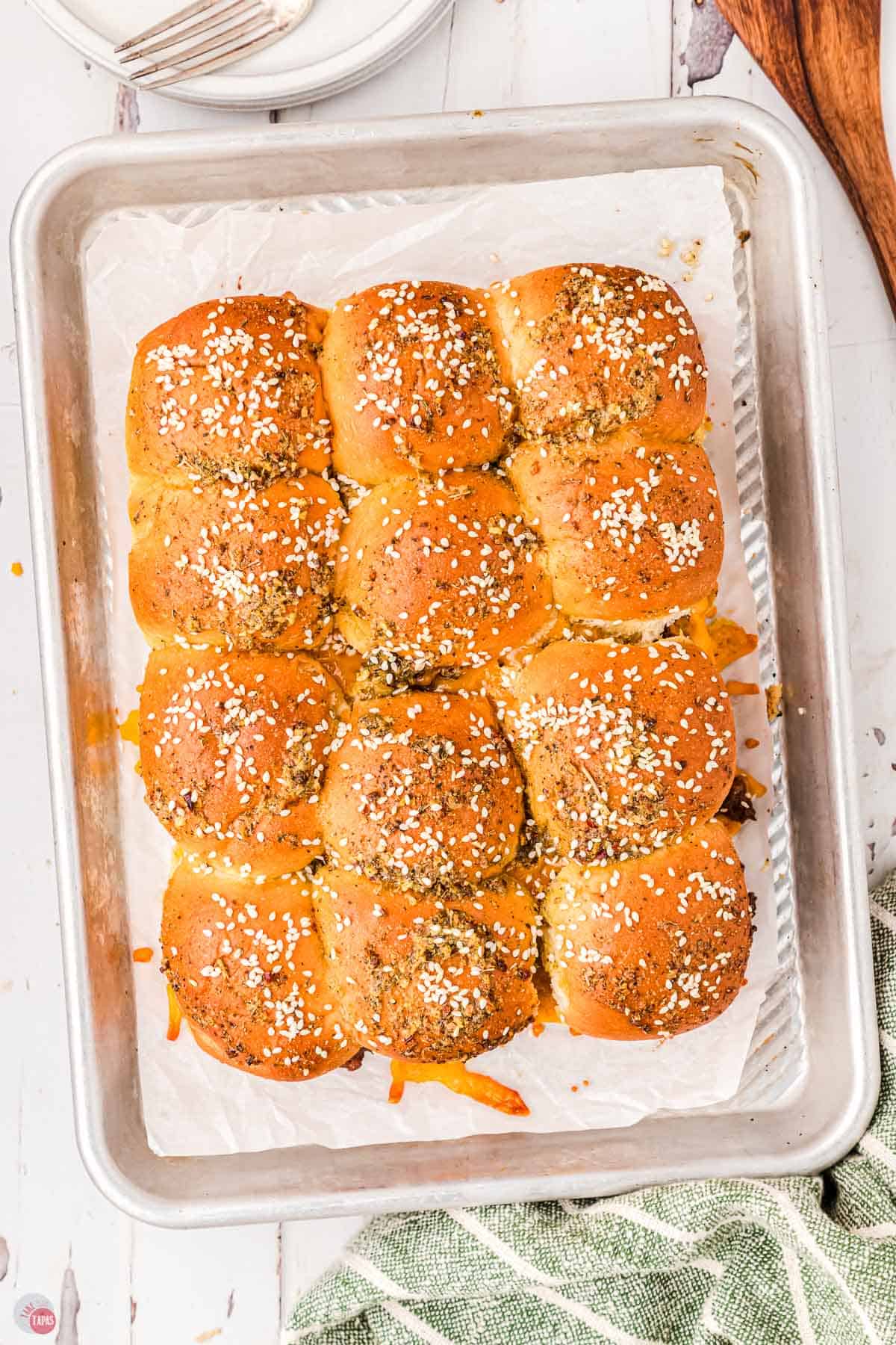 popular sloppy joe slider burgers on a baking sheet