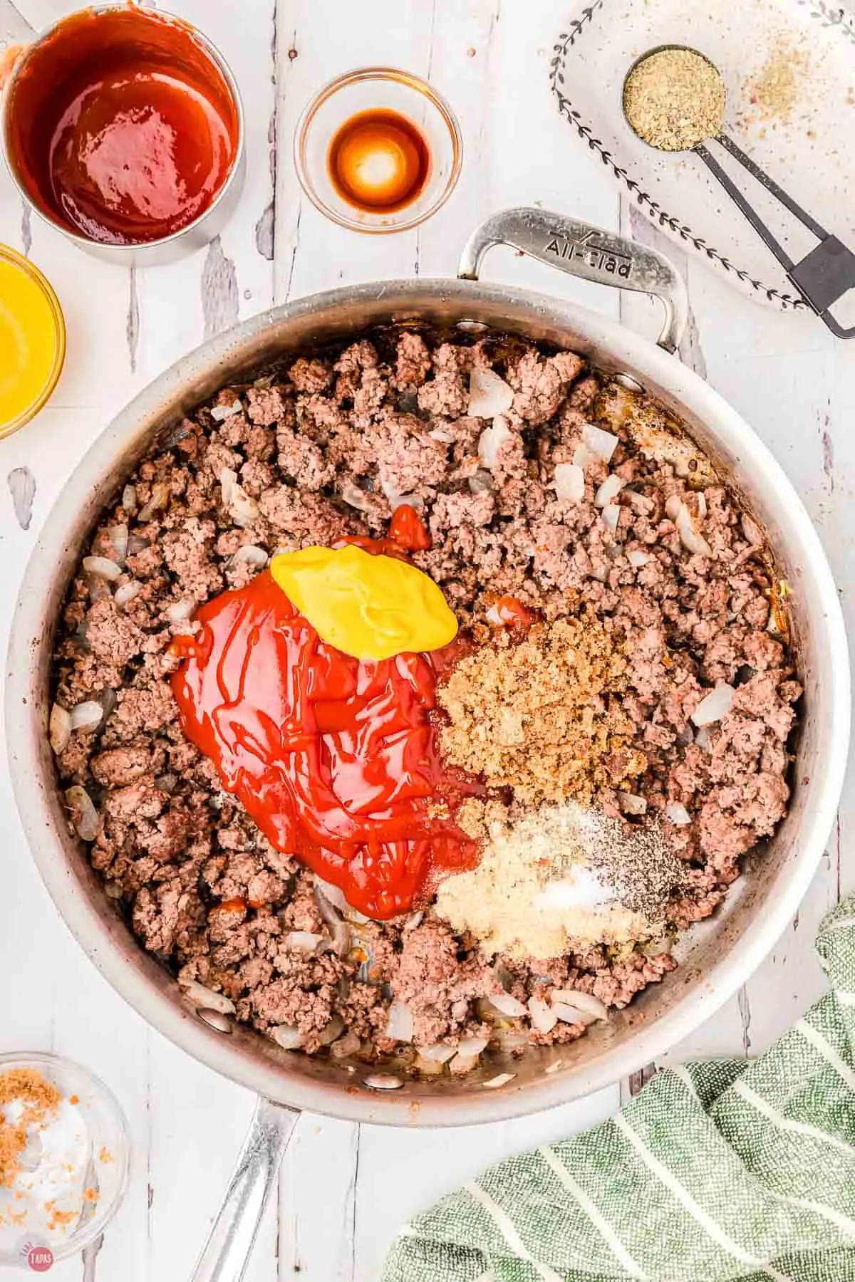 savory onions and tomato sauce in a skillet