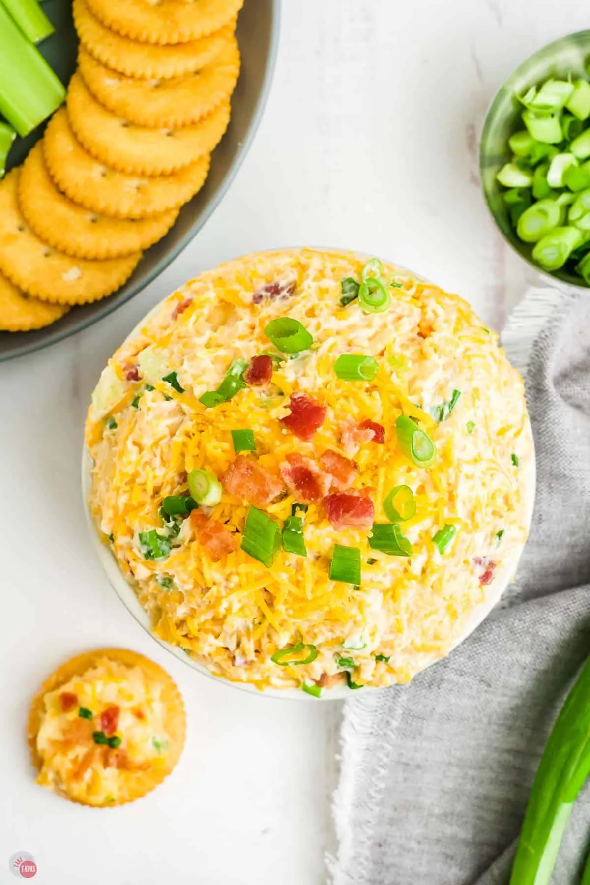 close up of Neiman Marcus dip with crackers and bacon on top