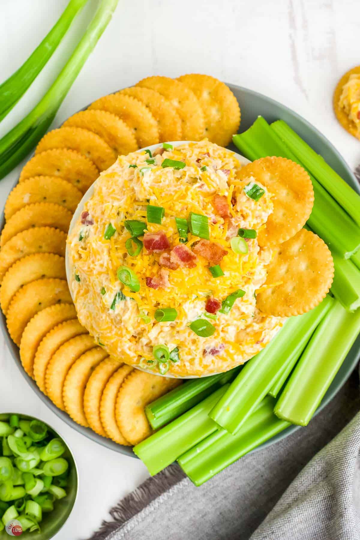 million dollar dip recipe in a bowl with crackers