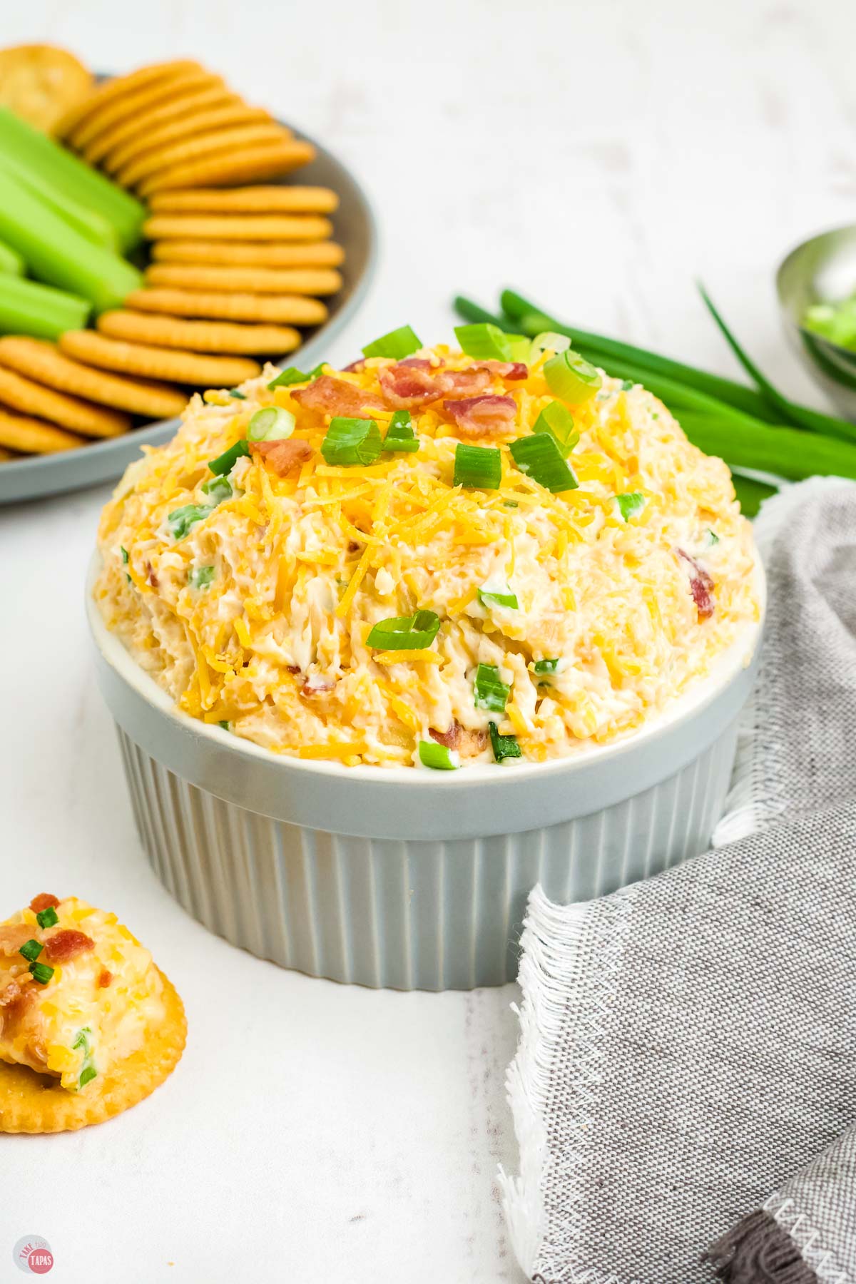 cheesy dip with a gray napkin