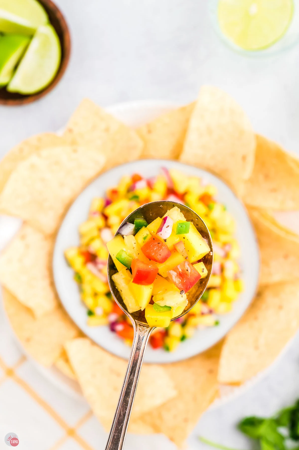 spoon of diced pineapple and pepper