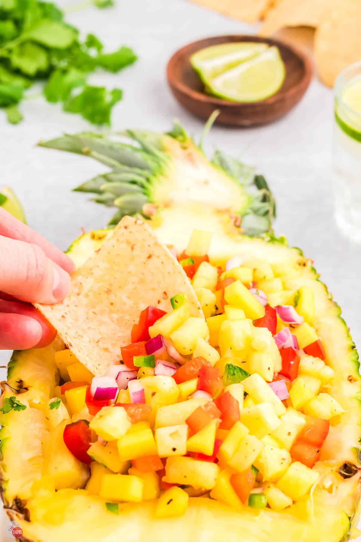 easy pineapple mango salsa recipe in a pineapple bowl