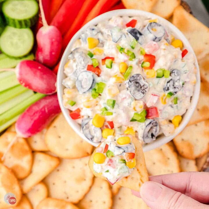 bowl of poolside dip with pita chips