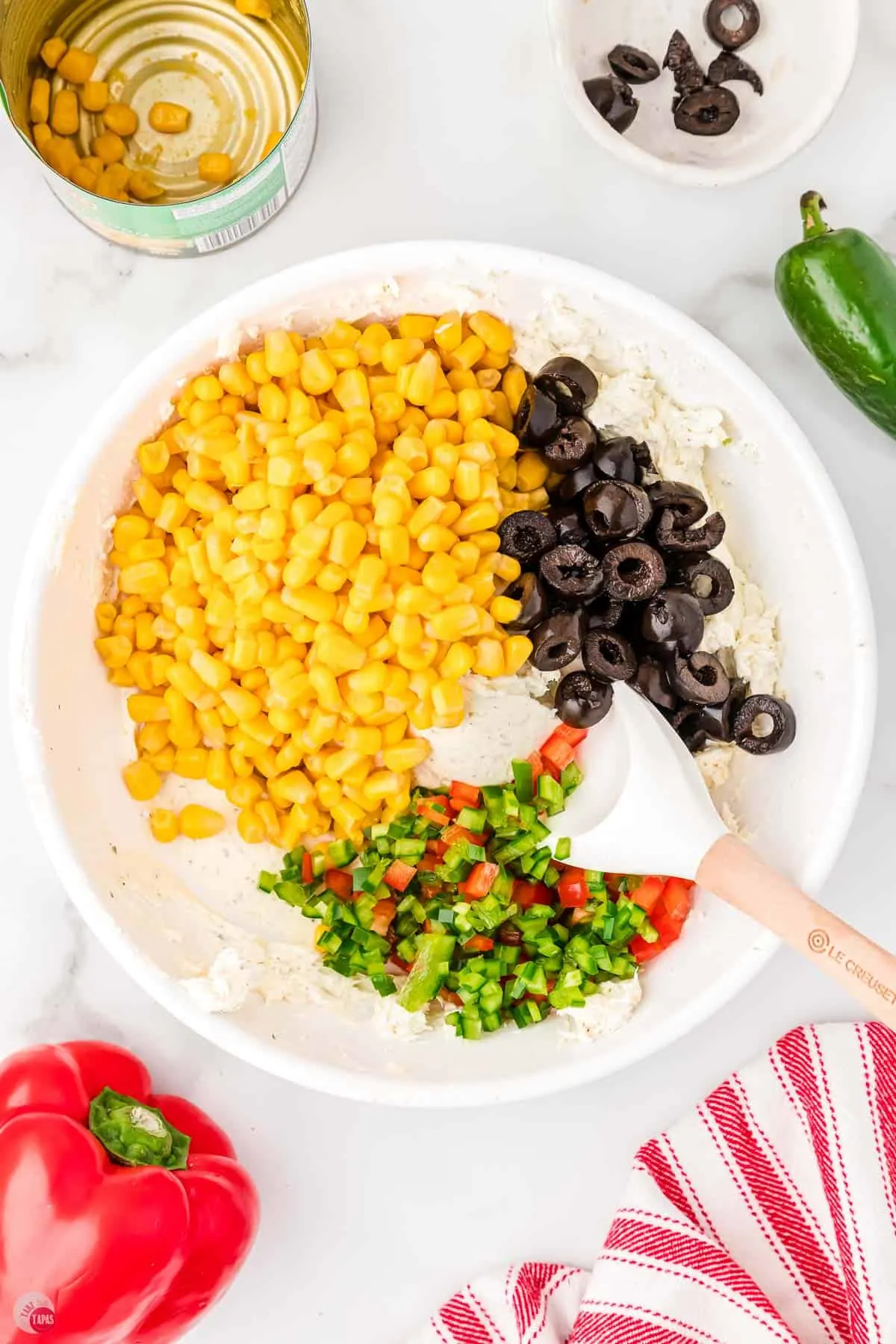 corn, olives, and peppers in a bowl