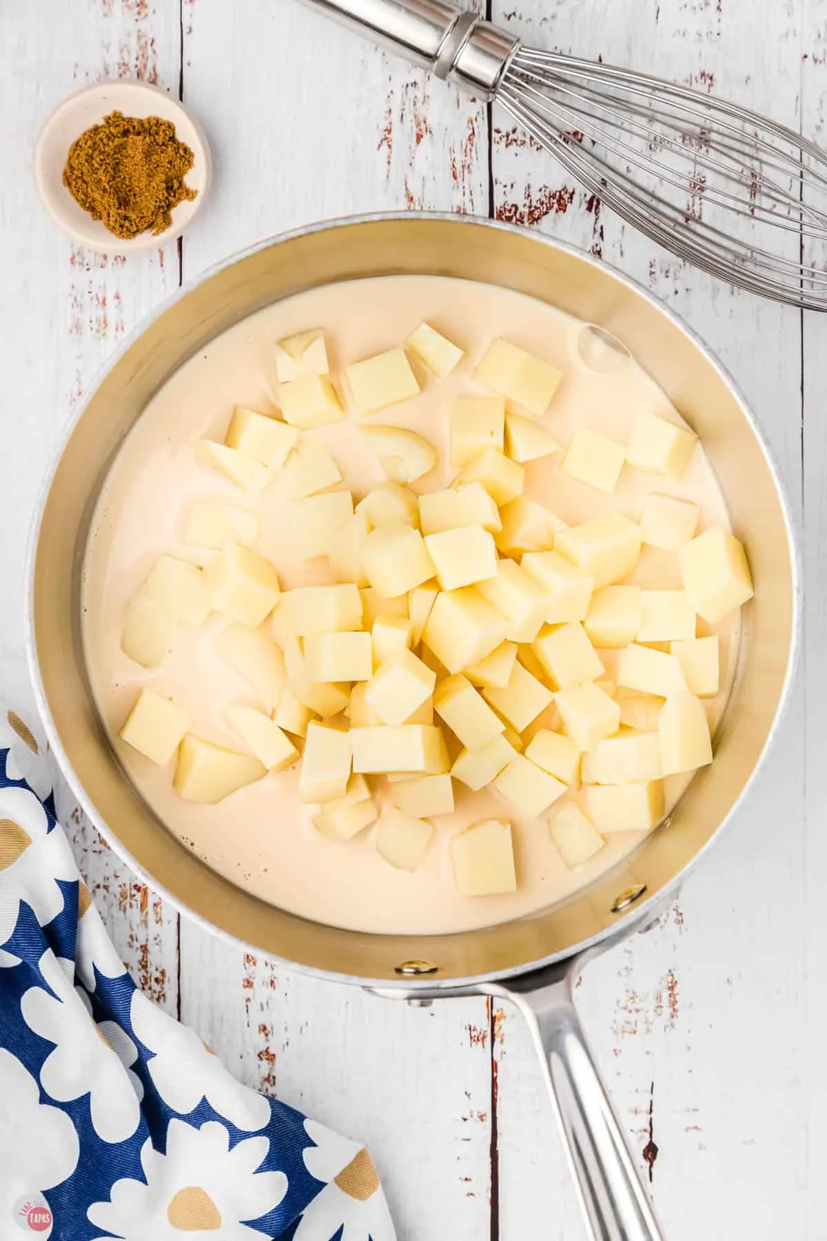 milk and cubes of fresh cheese