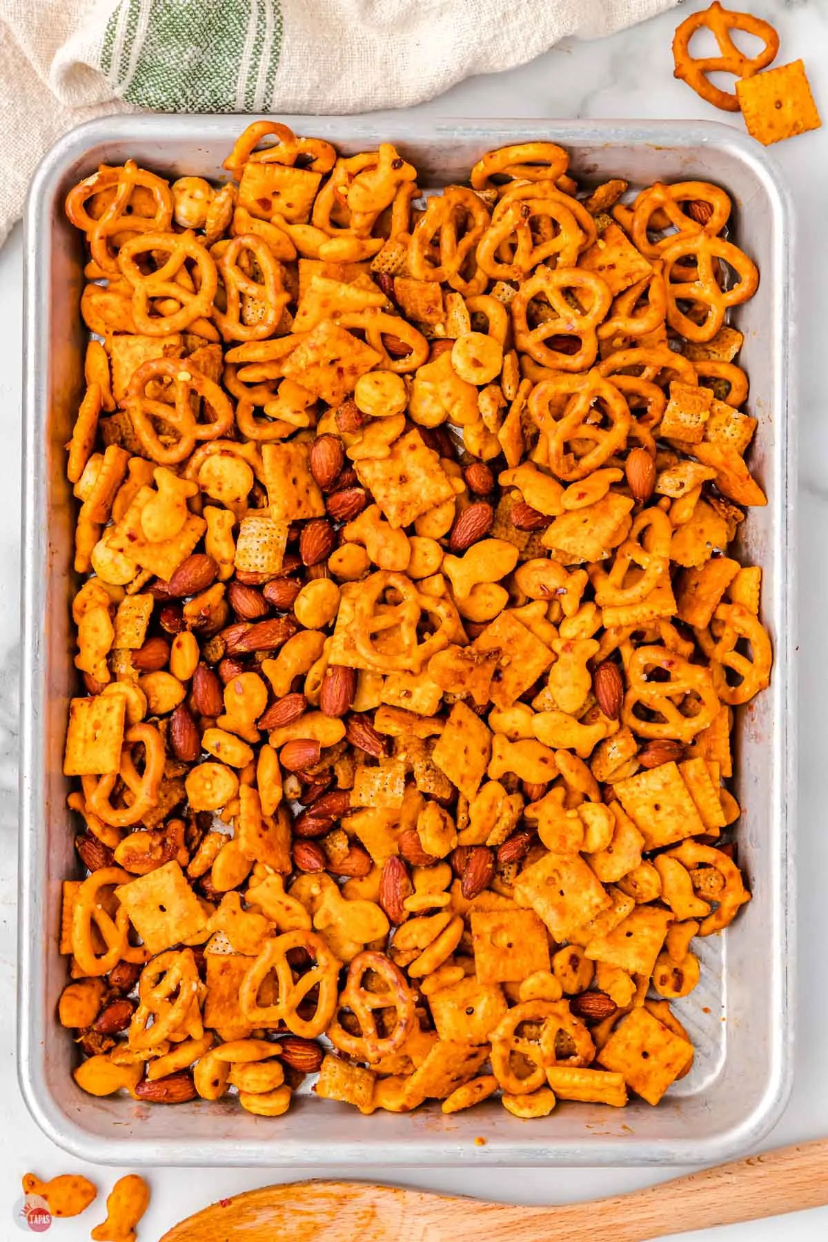 baked spicy chex mix on a baking sheet
