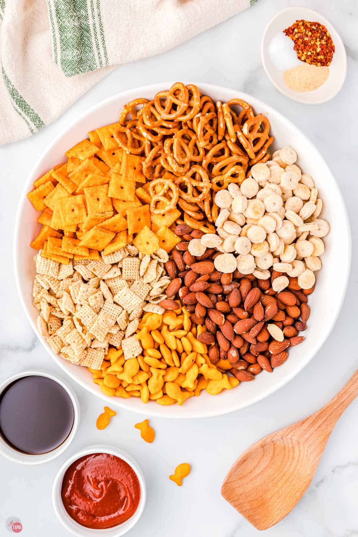 snack mix ingredients in a large microwavable bowl