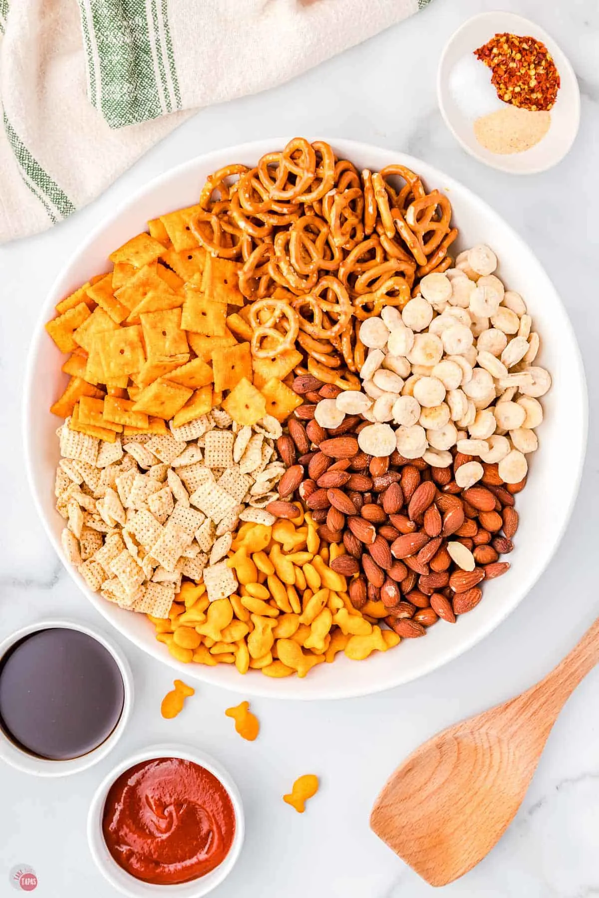 snack mix ingredients in a large microwavable bowl