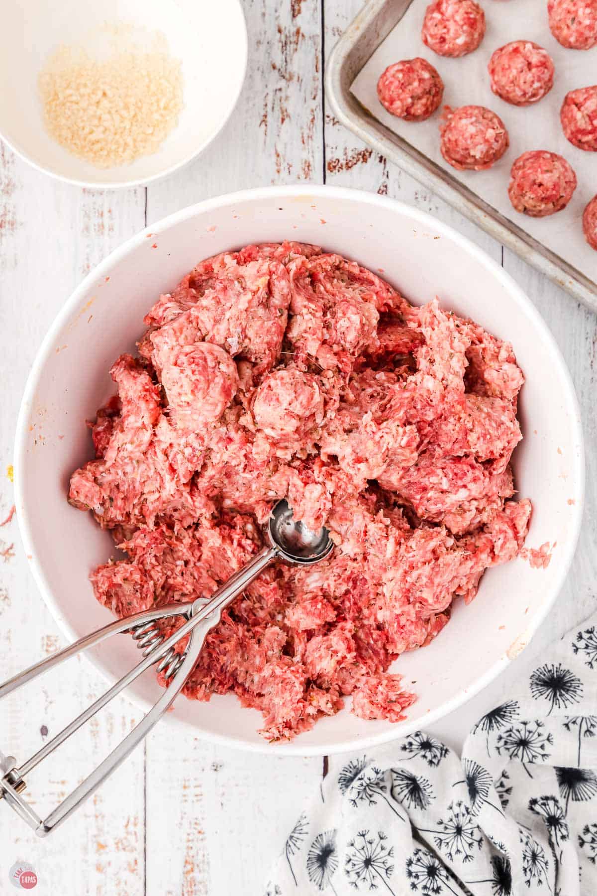 meatball mixture with an ice cream scoop