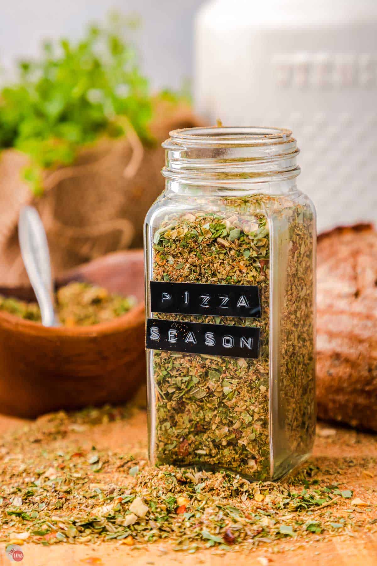 glass jar of spices with a black label