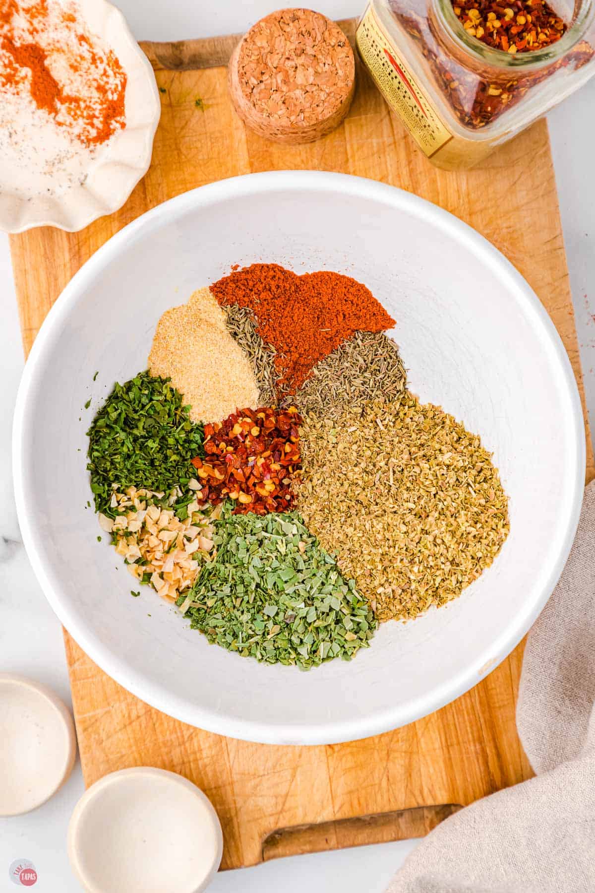 spices for pizza seasoning in a bowl unmixed