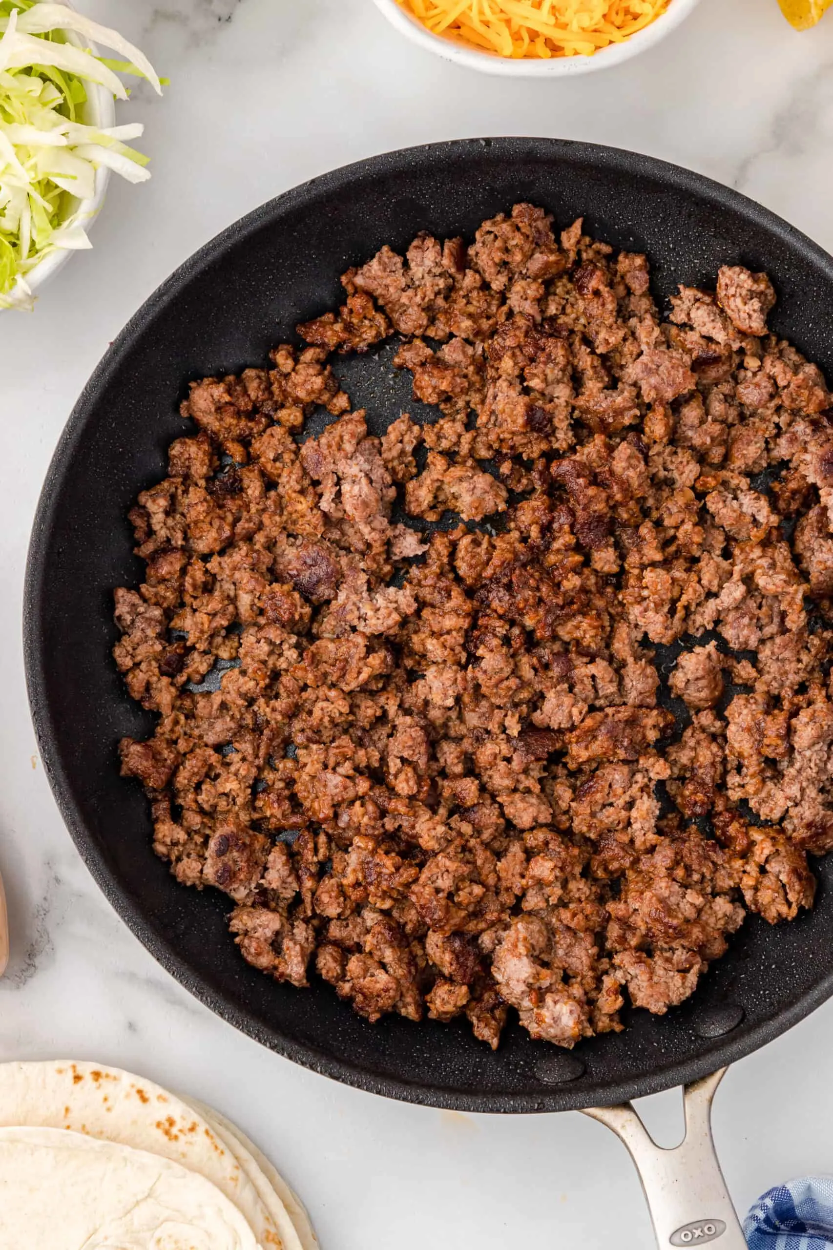 ground beef cooking in a pan