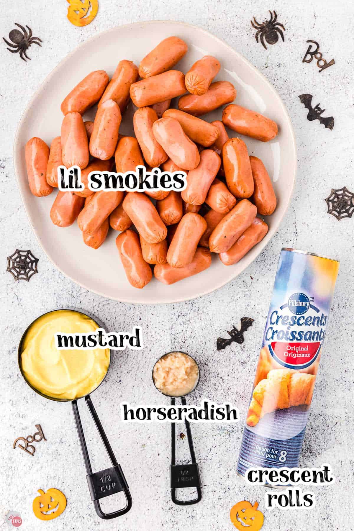 ingredients for mummy lil smokies on a marble backdrop